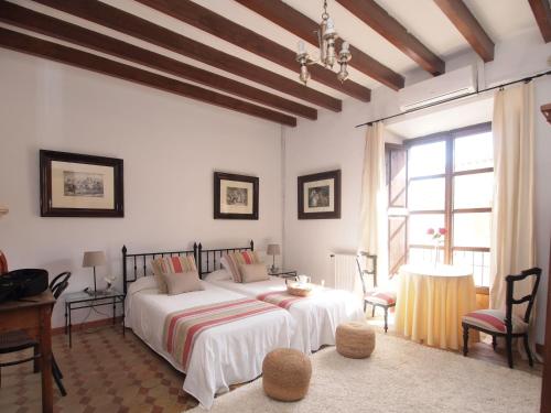 Кровать или кровати в номере León de Sineu