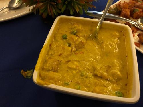 a dish of food with a fork in it on a table at SeaScape Port Blair in Port Blair