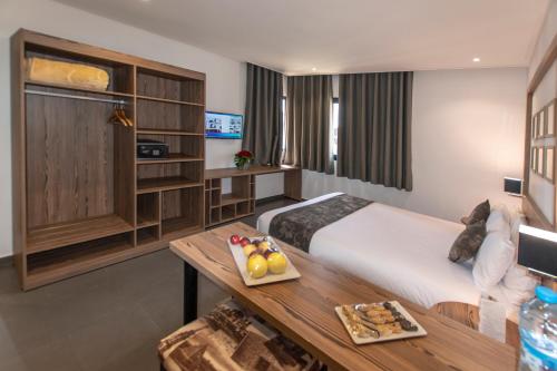 Voodi või voodid majutusasutuse Wazo Appart-Hôtel toas