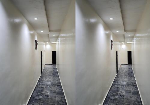 a hallway with white walls and a long corridor at Residency Hotel Lagos Airport in Lagos