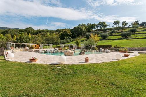a swimming pool in the middle of a yard at Gilda in Roccalbegna