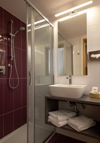 a bathroom with a sink and a shower at Hotel Villa Gioiosa in Lido di Jesolo