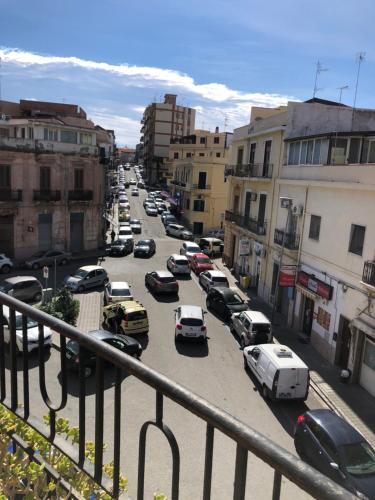 a city street filled with lots of parked cars at Araba Fenice in Reggio Calabria