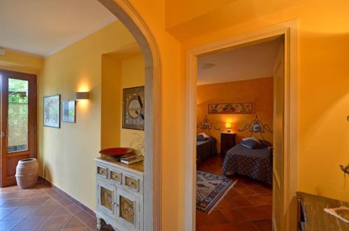 a room with a bedroom with two beds in it at Ciacchieri in Gaiole in Chianti
