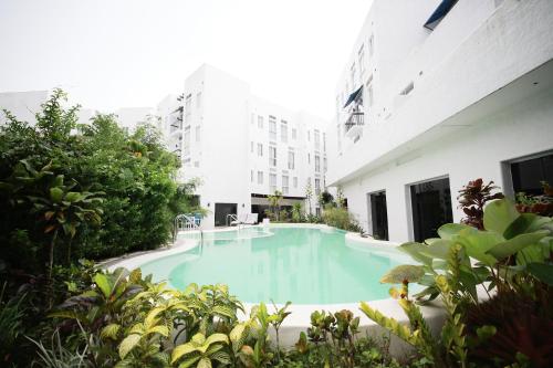 a swimming pool in the middle of a building at La Bella Boutique Hotel in Tagaytay