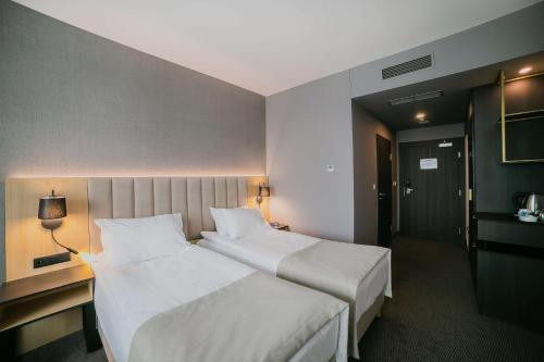 Un ou plusieurs lits dans un hébergement de l'établissement B&B HOTEL Warsaw East