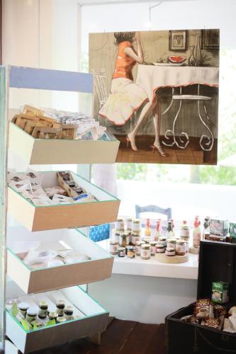 a collage of photos of a woman sitting at a table at La Bella Boutique Hotel in Tagaytay