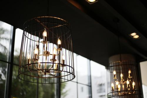 two chandeliers hanging from the ceiling in a room at La Bella Boutique Hotel in Tagaytay
