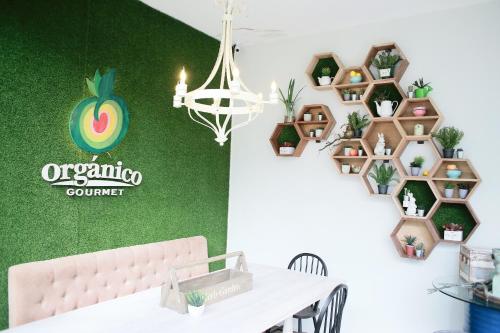 a room with a table and a wall with plants at La Bella Boutique Hotel in Tagaytay