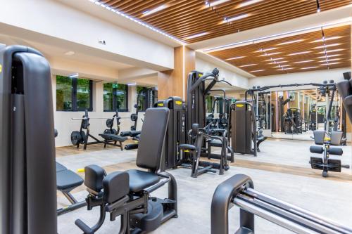 a gym with lots of treadmills and exercise equipment at Hotel Bulgaria in Burgas City