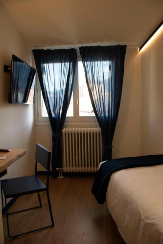 Ένα ή περισσότερα κρεβάτια σε δωμάτιο στο Hotel Alda Jolio Jaca