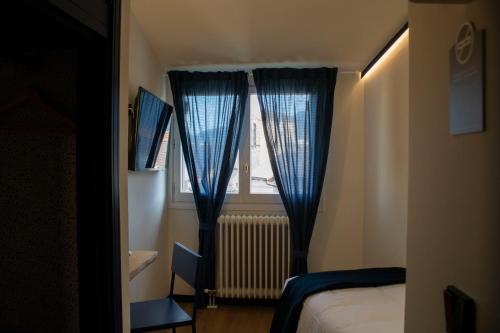Ένα ή περισσότερα κρεβάτια σε δωμάτιο στο Hotel Alda Jolio Jaca