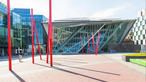 a group of red poles in front of a building at Travelodge PLUS Dublin City Centre in Dublin