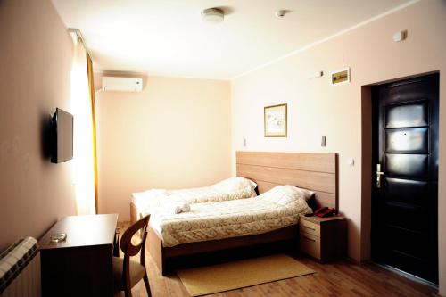 Кровать или кровати в номере Garni Hotel Crystal Ice