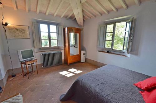 Ένα ή περισσότερα κρεβάτια σε δωμάτιο στο Villa dei Cavalli
