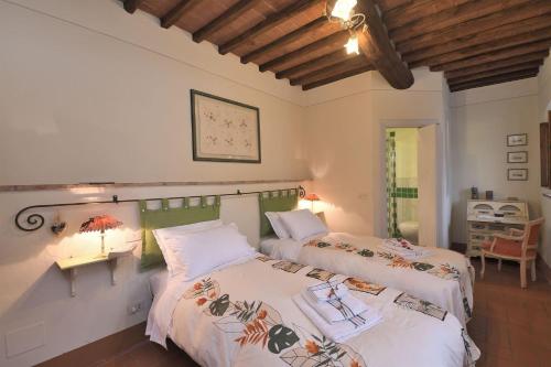 מיטה או מיטות בחדר ב-Margherita