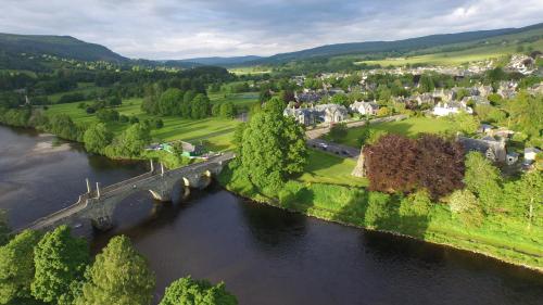 an aerial view of a river with a bridge at Farragon Luxury Glamping Pod with Hot Tub & Pet Friendly at Pitilie Pods in Aberfeldy