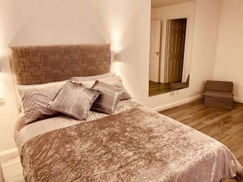 a bedroom with a large bed with two pillows at Waterside Star in Derry Londonderry