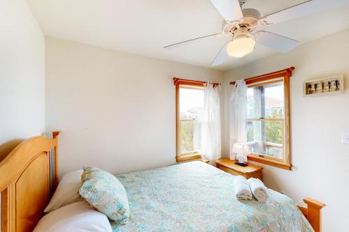 a bedroom with a bed and a ceiling fan at Enduring Freedom #6-8 in Avon