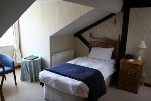 Katil atau katil-katil dalam bilik di Chiseldon House Hotel