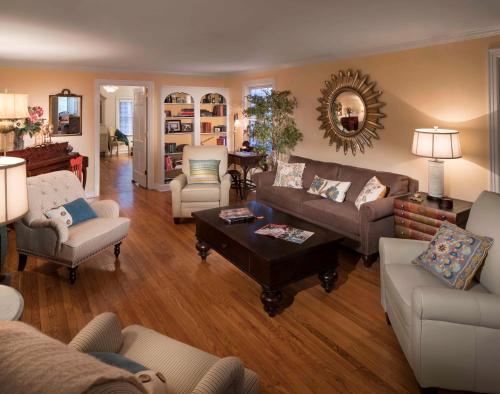 a living room with a couch and chairs at The Homestead in Madison