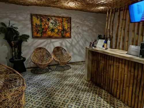 TV a/nebo společenská místnost v ubytování Hotel Casa Bamboo