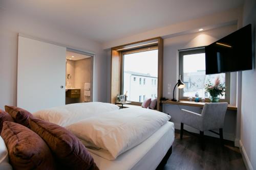 Postel nebo postele na pokoji v ubytování DOM Hotel LIMBURG