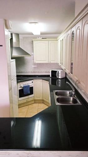 Kuchyň nebo kuchyňský kout v ubytování Apartamento El Crancs