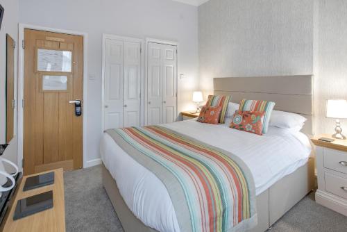 Katil atau katil-katil dalam bilik di Trelawney Hotel - Guest House