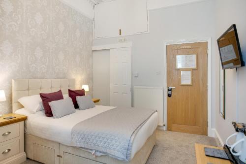Katil atau katil-katil dalam bilik di Trelawney Hotel - Guest House