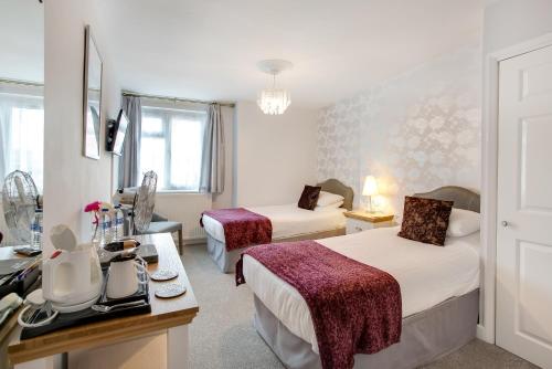 Katil atau katil-katil dalam bilik di Trelawney Hotel - Guest House