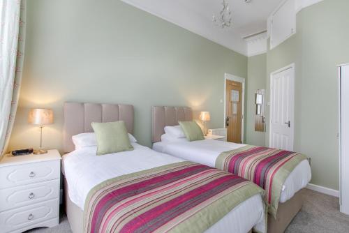 Katil atau katil-katil dalam bilik di Trelawney Hotel - Guest House