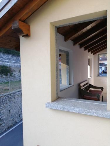 a view of a patio from a house with a window at Bellagio Holiday Home in Bellagio