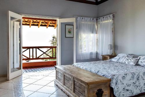 Säng eller sängar i ett rum på Casa de luxo com vista para o mar em Ilhabela