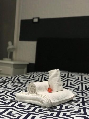 a towel sitting on top of a bed at Guest House Bracciano RM in Bracciano