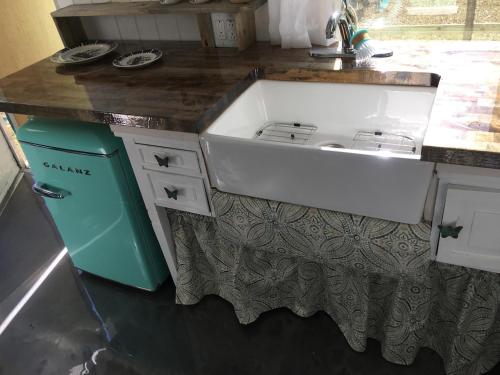 a kitchen with a sink and a counter top at Kokomo Farms in Live Oak