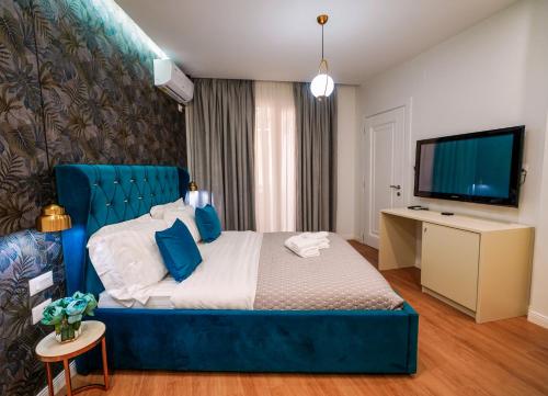 Кровать или кровати в номере Rama's Hotel