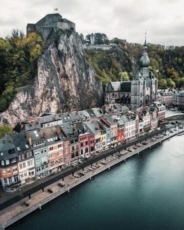 an aerial view of a city next to a body of water at Gîtes Sax 3 in Dinant