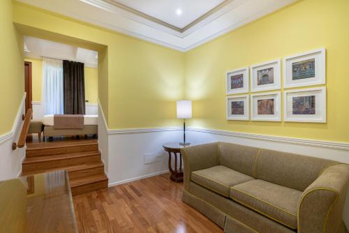 a living room with a couch and a table at Palazzo Turchini in Naples
