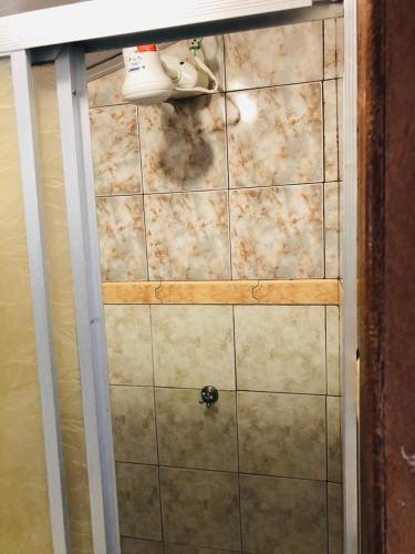 a bathroom with a tiled floor with smoke on it at Casa Ilha do Mel in Ilha do Mel