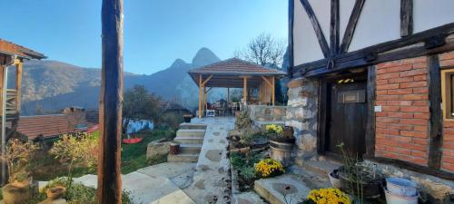 a garden with a gazebo and a stone pathway at Golemi kamik Pirot in Pirot