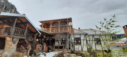 a house being constructed with a wooden roof at Golemi kamik Pirot in Pirot