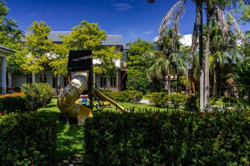 a playground in a park with a slide at Sheep House B&B in Jian