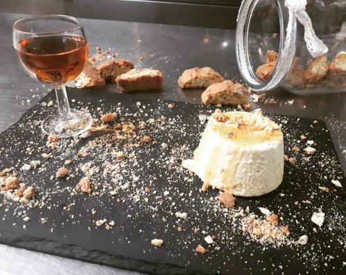 a piece of cake and a glass of wine at EcoHotel Ristorante Milano in Borgo a Mozzano