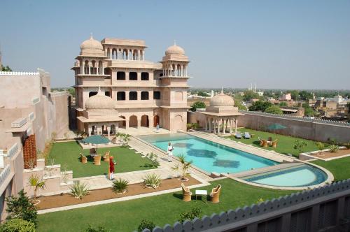 a view of a building with a swimming pool at Hotel Castle Mandawa in Mandāwa