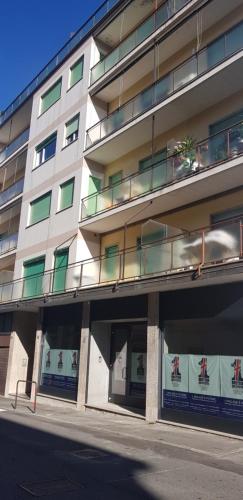 a large apartment building with balconies on the side of it at Appartamento La Casetta in Arona