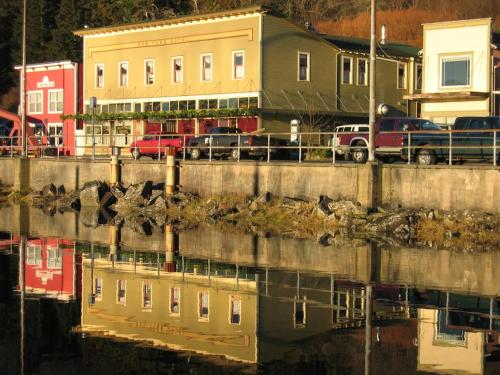 a body of water with houses and cars and buildings at Inn At Creek Street in Ketchikan