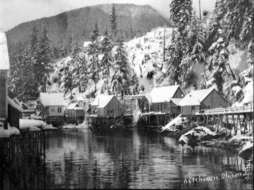 a black and white photo of a village in the snow at Inn At Creek Street in Ketchikan