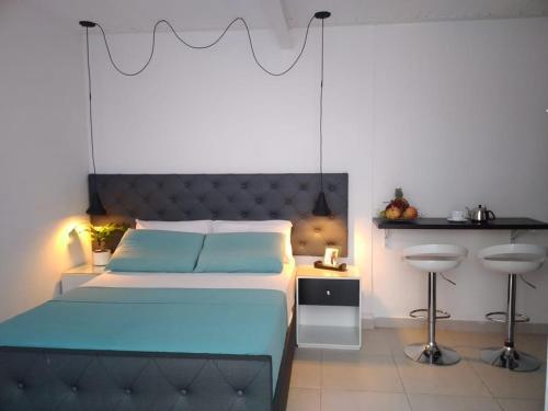Cama o camas de una habitación en VIP Apartasuites Rosales