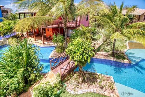 an aerial view of a resort with a swimming pool at Domus Villas in Pipa